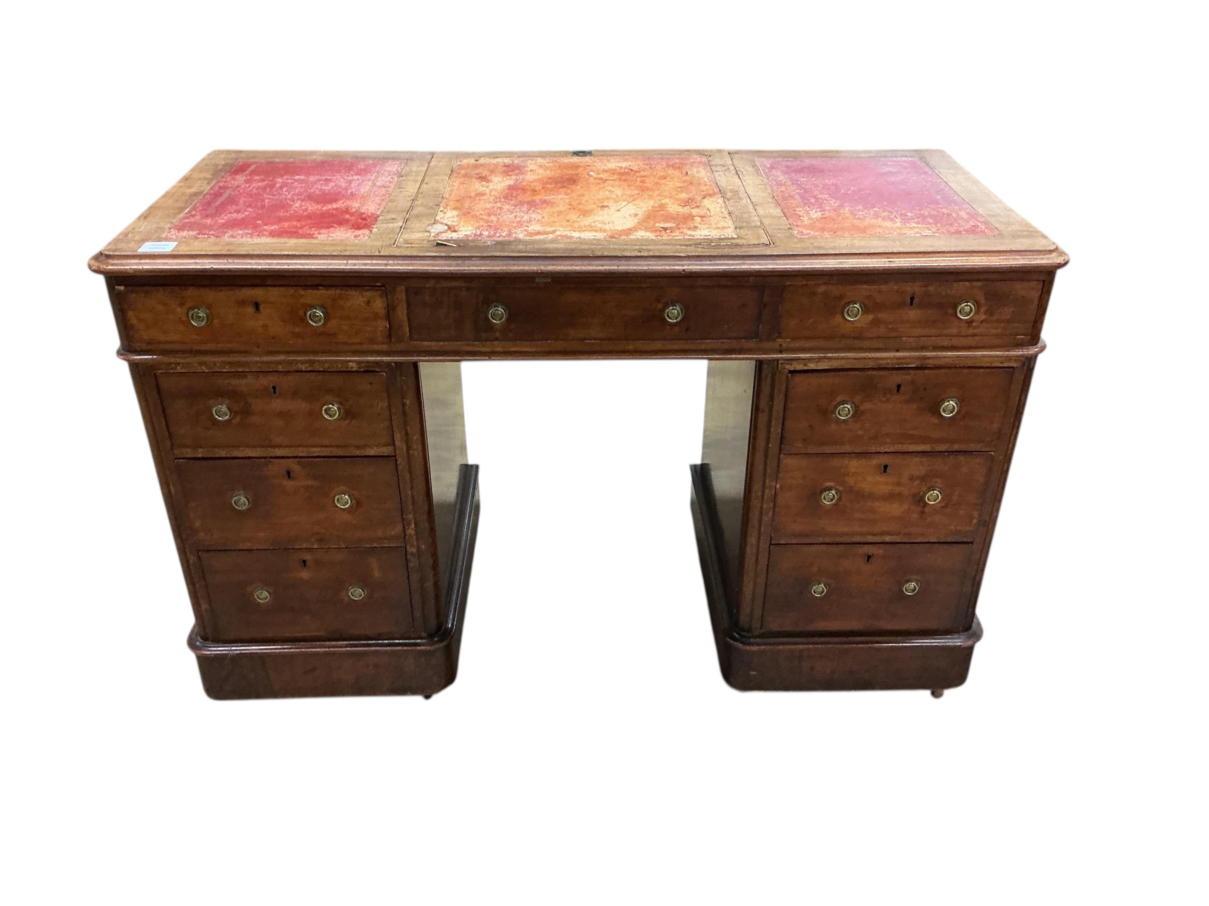 A Victorian mahogany pedestal desk, the top with hinged central section, width 122cm, depth 53cm, height 78cm